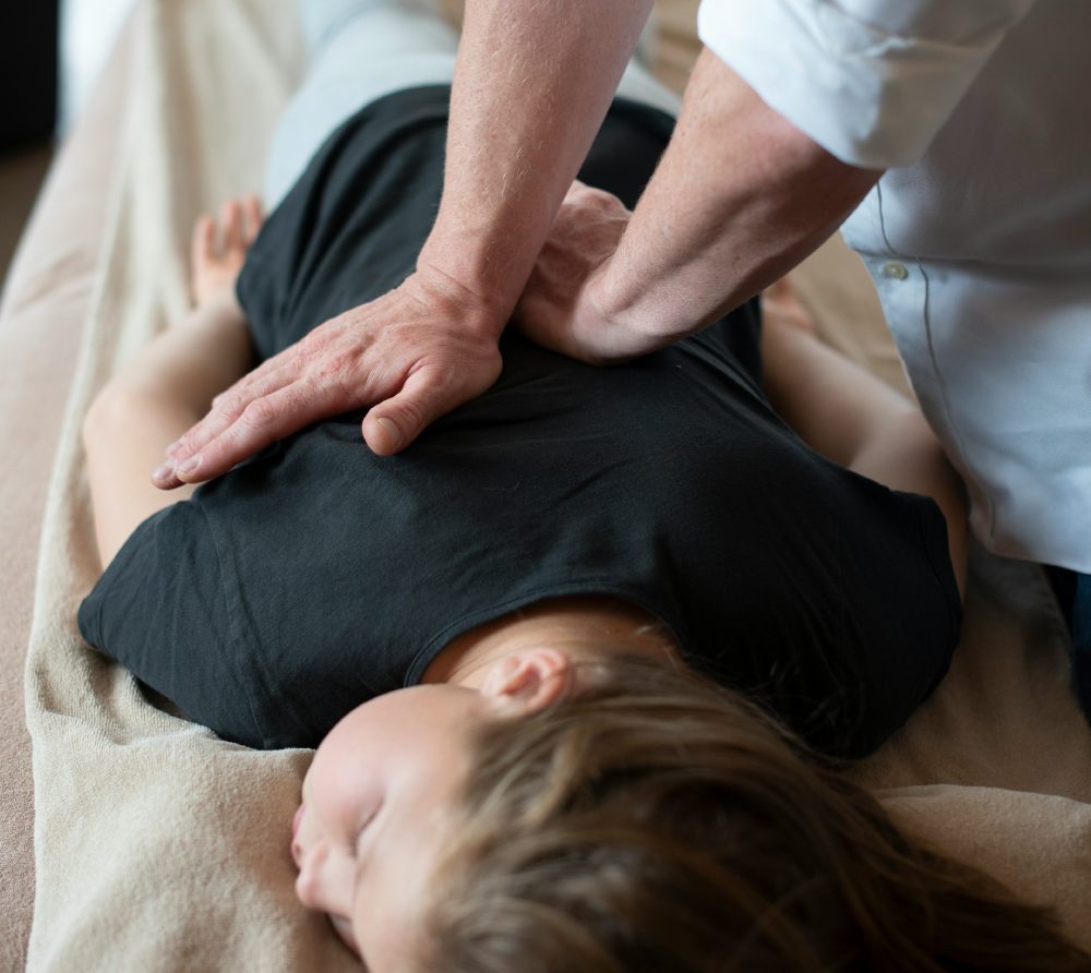 Chiropractic adjustment session at Newton Chiropractic in Irving, TX